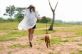 Asian lifestyle woman walking so happy with golden retriever friendship dog Royalty Free Stock Photo