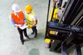 Asian lift truck driver and foreman in storage Royalty Free Stock Photo