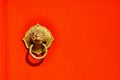 Asian Lion Door Knocker on Red Background Royalty Free Stock Photo