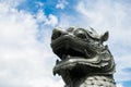 Asian lion statue leogryph chinthe metal grey at the base of Burmese Independence Monument Obelisk