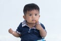 Asian little baby sitting and thinking Royalty Free Stock Photo