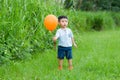 Asian little boy catch with ballooon