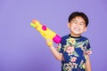 Asian little boy holding plastic water gun Royalty Free Stock Photo