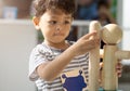 Asian little boy playing with wood toys Royalty Free Stock Photo