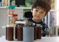 Asian little boy playing with wood toys Royalty Free Stock Photo