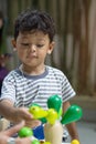 Asian little boy playing with wood toy Royalty Free Stock Photo