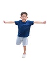 Asian little boy standing on one leg for balance and arms outstretched or keeping arms raised isolated on white background. Image Royalty Free Stock Photo