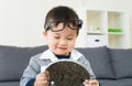 Asian little boy using mirror Royalty Free Stock Photo