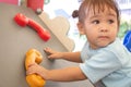 Asian little child girl climbing to slide at playground Royalty Free Stock Photo