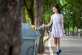 Asian little child girl hand holding plastic bottle,putting plastic water bottle in recycling bin,tourist woman hand throwing Royalty Free Stock Photo