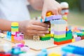 Asian little child girl hand playing with colorful toy blocks Royalty Free Stock Photo