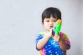 Asian little child girl having fun to play water with water gun in Songkran festival Thailand Royalty Free Stock Photo