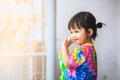 Asian little child girl having fun to play water with water gun in Songkran festival Thailand Royalty Free Stock Photo