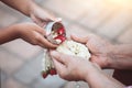 Asian little child girl pouring water on hands of elder senior Royalty Free Stock Photo