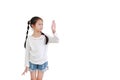 Asian little child girl shows palm hand isolated on white background. Kid gestures five fingers and looking beside with copy space Royalty Free Stock Photo