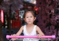 Asian little child girl sitting in the trolley during family shopping in the market Royalty Free Stock Photo