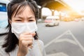 Asian little child girl suffer from cough with face mask protection,sick woman wearing medical mask because of air pollution in Royalty Free Stock Photo