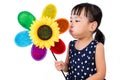 Asian Little Chinese Girl Blowing Colorful Windmill Royalty Free Stock Photo