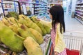 Asian Little Chinese Girl choosing fruits