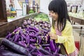 Asian Little Chinese Girl choosing vegetables