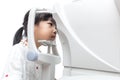 Asian Little Chinese Girl Doing Eyes Examination Through Auto re Royalty Free Stock Photo