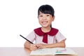 Asian Little Chinese girl drawing with color pencils Royalty Free Stock Photo
