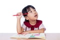 Asian Little Chinese girl drawing with color pencils Royalty Free Stock Photo