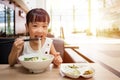 Asian little Chinese girl eating beef noodles soup Royalty Free Stock Photo