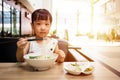 Asian little Chinese girl eating beef noodles soup Royalty Free Stock Photo