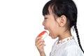 Asian Little Chinese Girl Eating Donuts