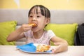 Asian Little Chinese Girl Eating pizza