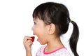 Asian Little Chinese Girl Eating Strawberry Royalty Free Stock Photo