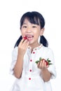 Asian Little Chinese Girl Eating Strawberry Royalty Free Stock Photo