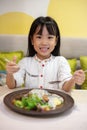 Asian Little Chinese Girl Eating Western Food Royalty Free Stock Photo