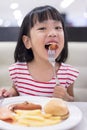 Asian Little Chinese Girl Eating Western Food Royalty Free Stock Photo