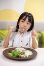 Asian Little Chinese Girl Eating Western Food Royalty Free Stock Photo