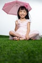 Asian Little Chinese Girl holding umbrella