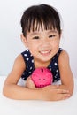 Asian Little Chinese Girl Hugging Piggy Bank Royalty Free Stock Photo