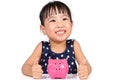 Asian Little Chinese Girl With Piggy Bank Royalty Free Stock Photo