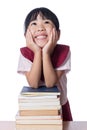 Asian Little Chinese girl with piles of books Royalty Free Stock Photo