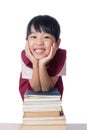 Asian Little Chinese girl with piles of books Royalty Free Stock Photo
