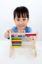 Asian Little Chinese Girl Playing Colorful Abacus Royalty Free Stock Photo