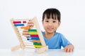 Asian Little Chinese Girl Playing Colorful Abacus