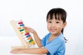 Asian Little Chinese Girl Playing Colorful Abacus Royalty Free Stock Photo