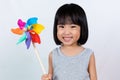 Asian Little Chinese Girl Playing Colorful Pinwheel Royalty Free Stock Photo