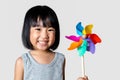 Asian Little Chinese Girl Playing Colorful Pinwheel Royalty Free Stock Photo