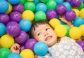 Asian Little Chinese Girl Playing with Colorful Plastic Balls Royalty Free Stock Photo