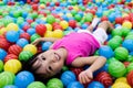 Asian Little Chinese Girl Playing with Colorful Plastic Balls
