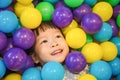 Asian Little Chinese Girl Playing with Colorful Plastic Balls Royalty Free Stock Photo