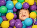 Asian Little Chinese Girl Playing with Colorful Plastic Balls Royalty Free Stock Photo